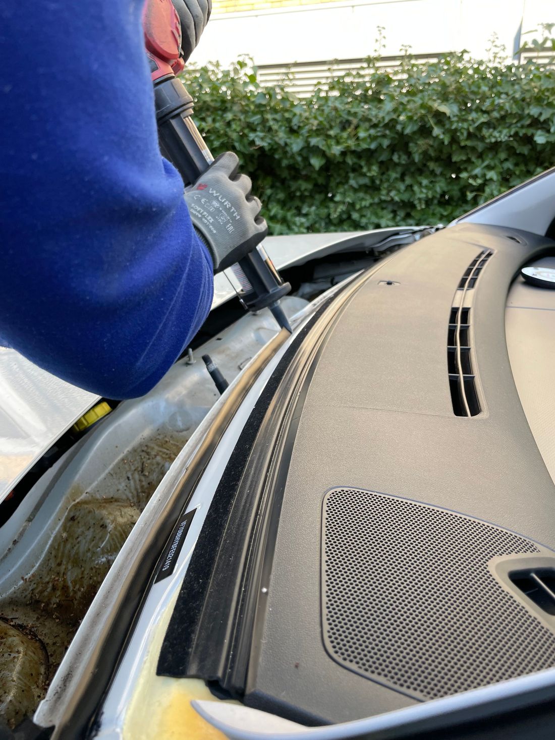 A technician repairing auto glass