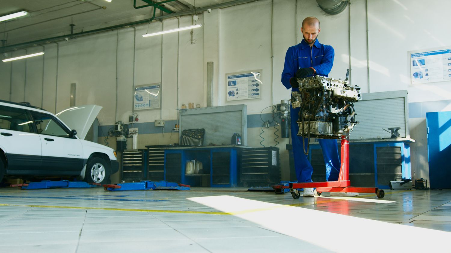 A technician working in a well-lit service bay