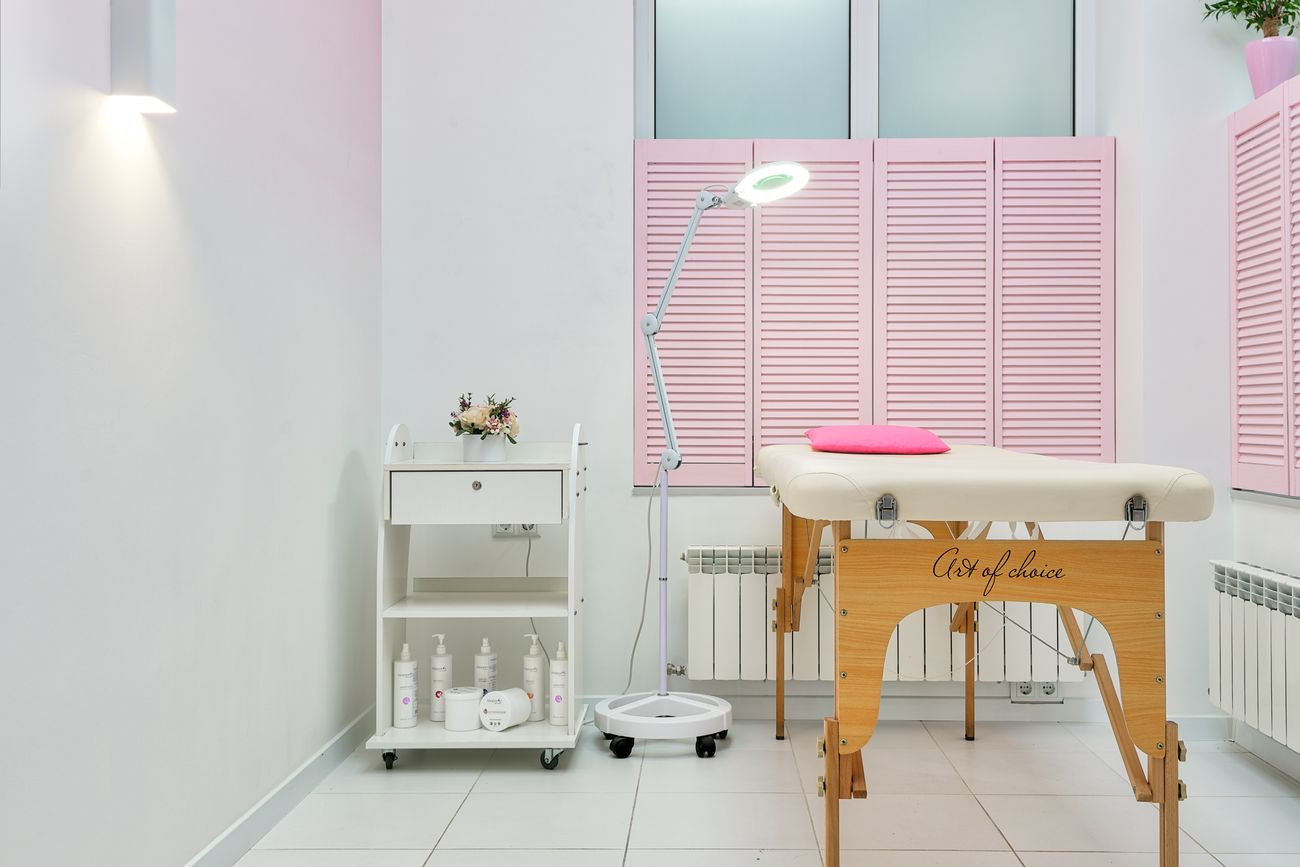 A treatment area with soft seating and skincare products
