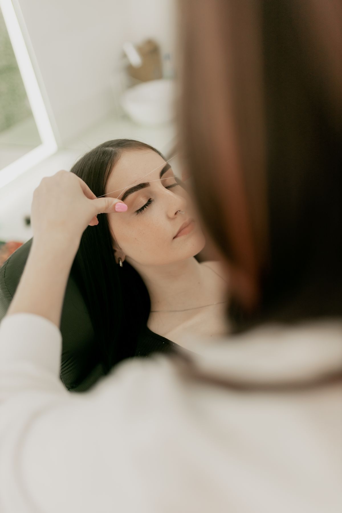 A brow shaping treatment in a calm studio