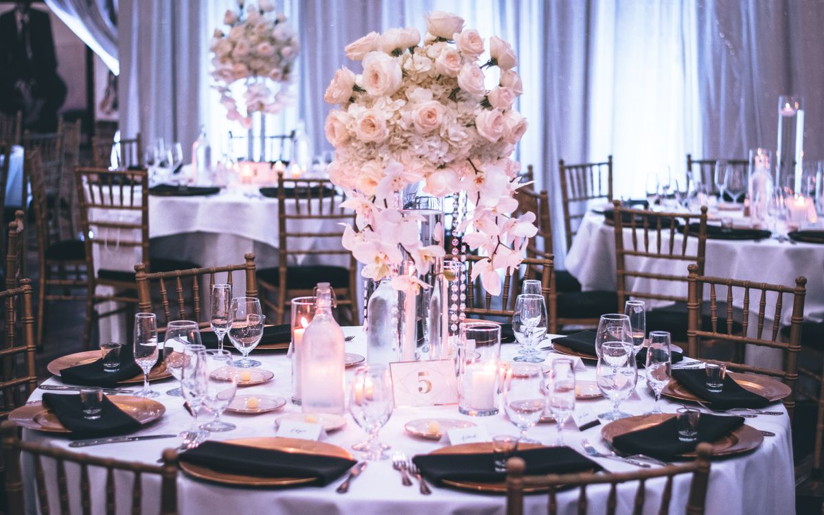 Reception tables dressed in white florals